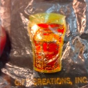 New Women's coca cola pin still in the package